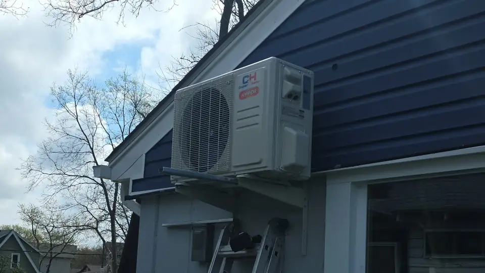 Ductless mini-split condenser being installed on a home in the Fox Valley, Illinois